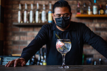 Bartender preparing a cocktail at the bar