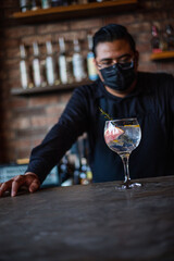 Bartender preparing a cocktail at the bar