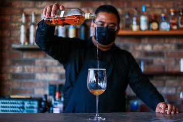 Bartender preparing a cocktail at the bar