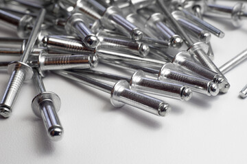 Silver rivets on white isolate. Chrome traction rivets for hand tools.