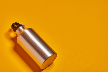 Small stainless steel bottles for water and camping.