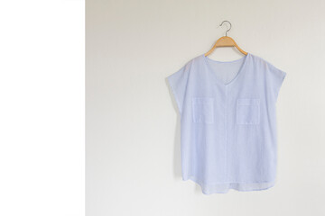 Woman blouse with blue blouse cotton on white background.text space.