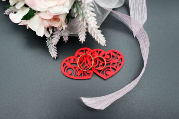 wedding rings with bridal bouquet