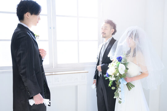 The Father Watches Over The Bride And The Groom Welcomes Her.