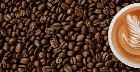 Cup of coffee with aroma roasted beans