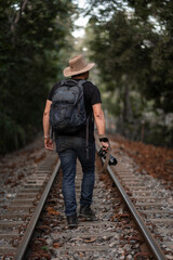 Back photographer between train tracks