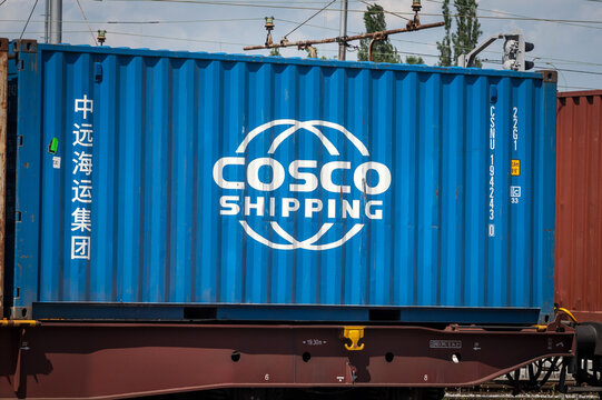 LJUBLJANA, SLOVENIA - JUNE 16, 2021: Logo of Cosco shipping on a container on a freight train in ljubljana. Cosco is a Chinese logistics and cargo transportation carrier company. ..