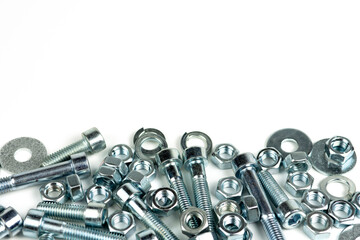 several metal bolts of silvery color on a white background. close-up and copy space