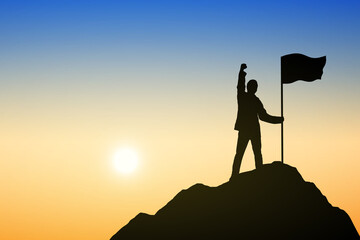 Silhouette of people and flag on top mountain, Sky and sun light background. Business success and goal concept.	