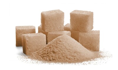 Pile of brown granulated sugar and sugar cubes on the desk