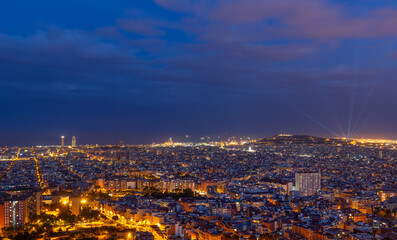 Scenic bird's eye view of Barcelona city at evening twilight