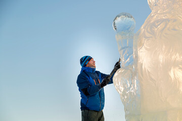 Portrait of a sculptor at work on a figure