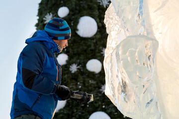 Portrait of a sculptor at work on a figure