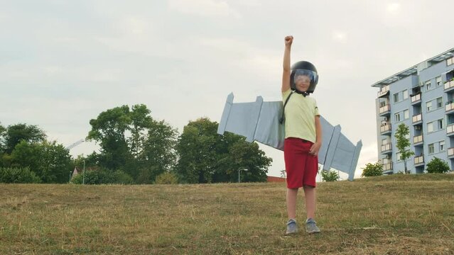 Creative child pretend to be pilot, Young cute boy wearing jet pack