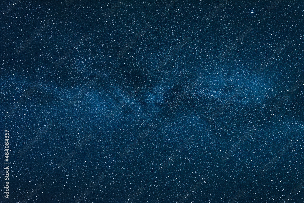 Wall mural clear night sky with milky way and huge amount of stars.