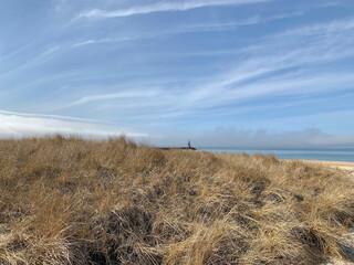 Fototapeta na wymiar Channel Marker in Montauk Beyond Grass on Sand Dunes, NY, US