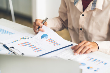 Business and finance concept, Business woman using calculator to calculate business data at office.