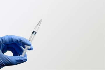 A doctor holds vaccine against new covid-19 omicron variant on a background