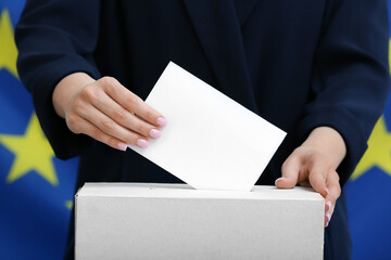 Voting woman with paper near ballot box against European Union flag, closeup
