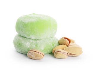 Delicious mochi and pistachios on white background