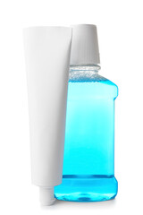 Tooth paste and mouthwash on white background