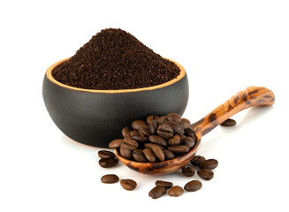 ground coffee in a cup with a spoon of coffee beans isolated on white background