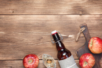 Fototapeta na wymiar Apple cider vinegar, salad dressing, homemade fruit wine. Food fermented supplement. Wooden background with copy space