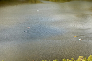 green lake water and pleasure boats floating in the lake