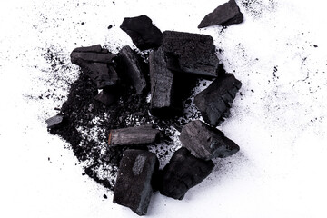Pile of natural wood charcoal Isolated on white background. activated carbon.