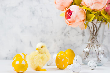 Easter card with colored eggs and chickens on a light background. Happy easter concept.Copy space.