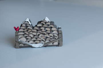 Wood pile snow and bird