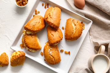 Plate of tasty sochniki with cottage cheese on white background