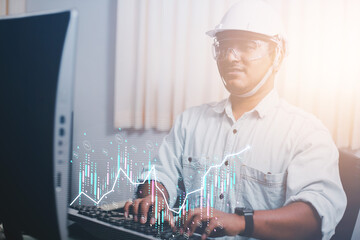 Engineers study financial trade by looking at an overview of the industrial holographic revenue charts. and the future of Uncle Capital from the impact of the economic market
