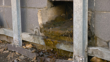 Photo of broken facade of the house by vandals