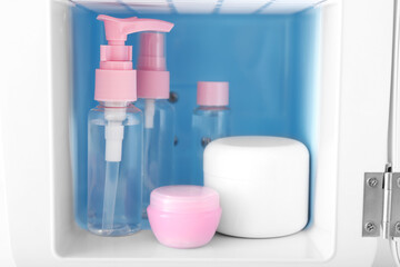 Small refrigerator with cosmetic products, closeup