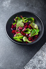 beet salad beetroot, onion, lettuce ready to eat fresh portion dietary healthy meal food diet still life snack on the table copy space food background rustic top view keto or paleo diet