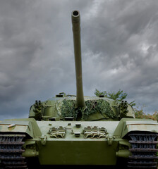 Large tank seen from the front on a grey and gloomy day.