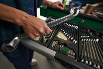 Fototapeta na wymiar Mechanic toolbox with metal equipments in aircraft hangar