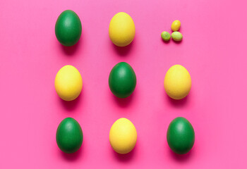 Different painted Easter eggs on color background