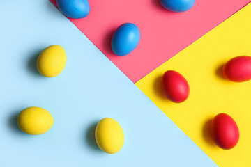 Multicolored Easter eggs on color background
