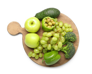 Wooden board with different vegetables and fruits for St. Patrick's Day celebration on white background
