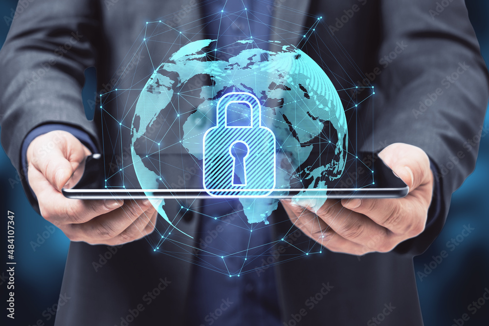 Poster close up of hands holding pad with abstract glowing globe hologram with security padlock icon on blu