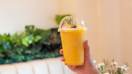 Orange juice in a clear plastic cup