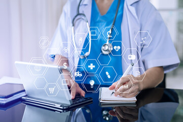 medical technology concept,smart doctor hand working with modern laptop computer with his team virtual icon