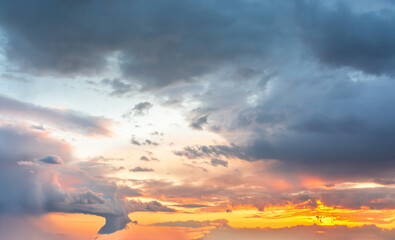 Beautiful clouds in the sky. Colorful sunset or dawn. landscape with sunbeams
