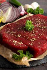 Concept of tasty food with raw beef steak, close up