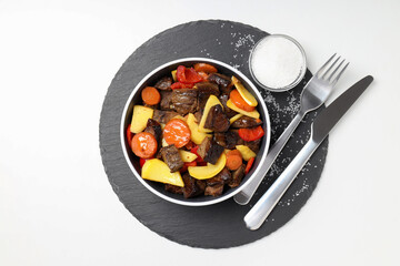 Concept of tasty food with beef with vegetables on white background