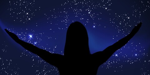 Silhouette of a woman enjoying countryside under the starry skies.