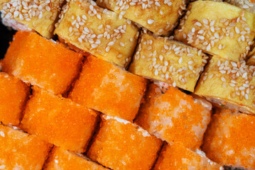 Overhead top view stock color photography of assorted sushi. Rolls pattern photo background
