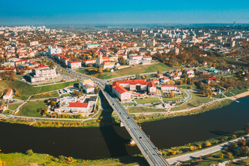Fototapeta premium Grodno, Belarus. Aerial Bird's-eye View Of Hrodna Cityscape Skyline. Famous Popular Historic Landmarks In Sunny Autumn Day.Grodno, Belarus. Aerial Bird's-eye View Of Hrodna Cityscape Skyline. Famous